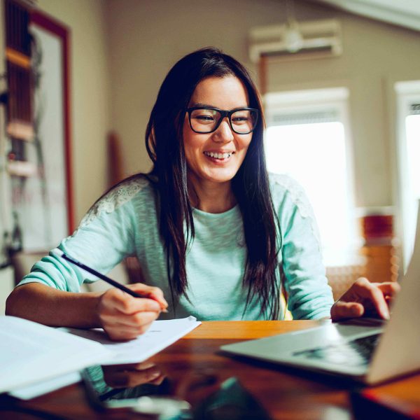 Banner asian woman smiling at desk