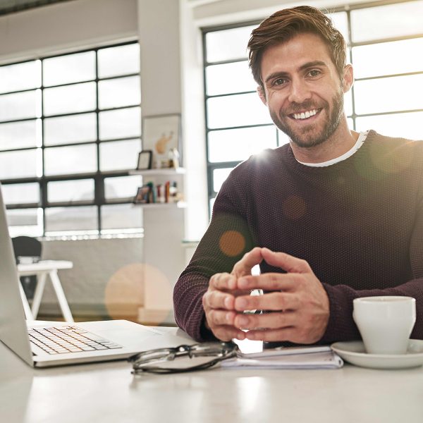 square-smiling-man-desk-1200x1200