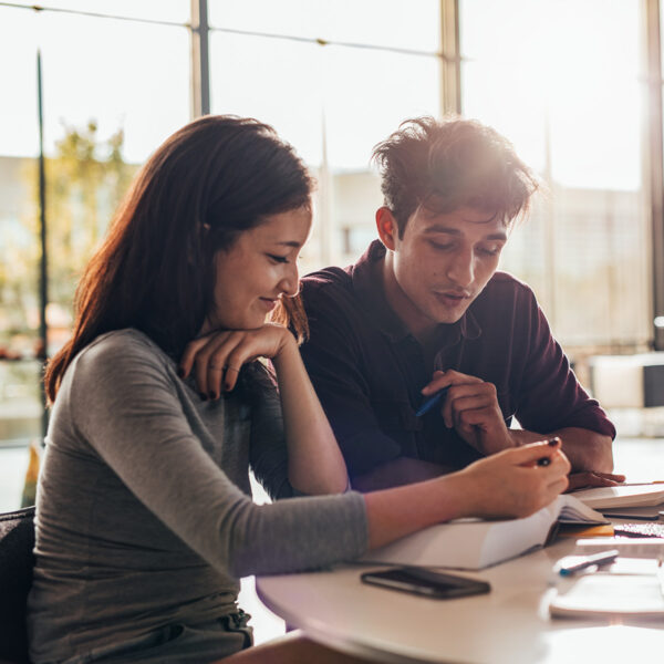 University students studying together in class.