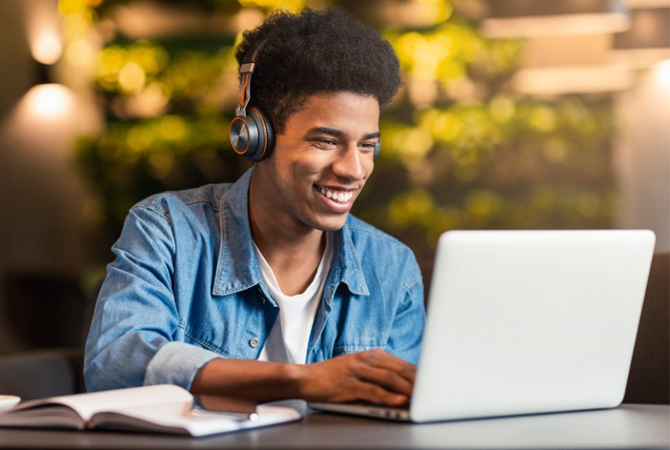 Student-smiling-on-laptop